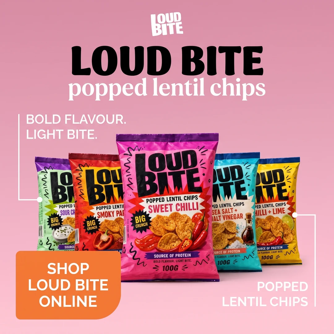 A Loud Bite advert on a pink background using the same arrangement: small wordmark on top, headline, five snack bags at a diagonal, two leader line callouts and an orange shop badge in the bottom left